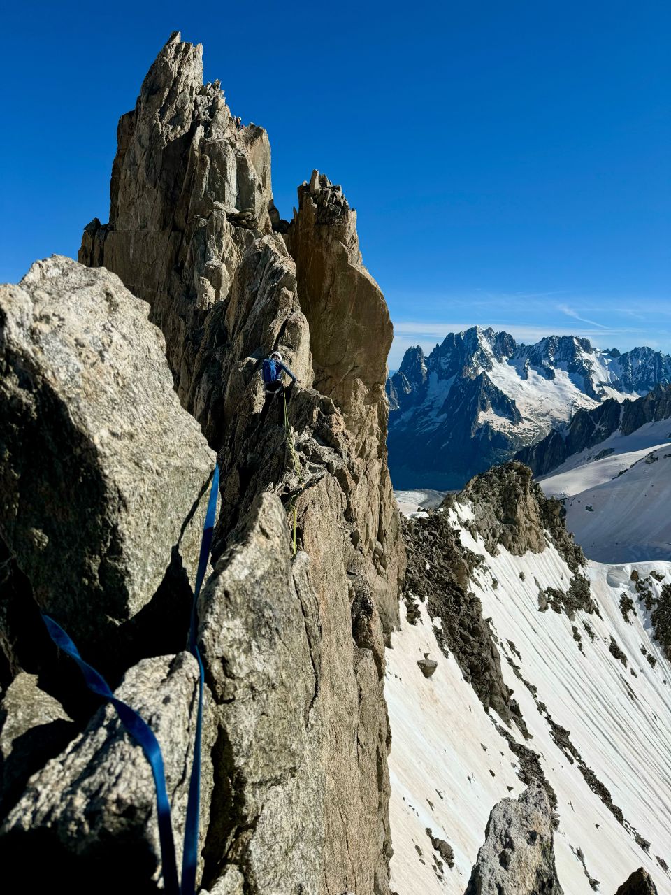 Climber on a snowy ridge of the Aiguilles d'Entrèves